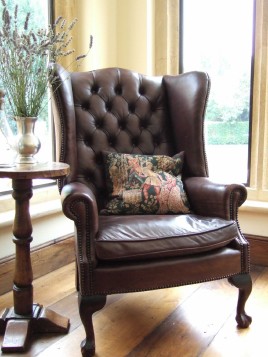 Leather winged arm chair